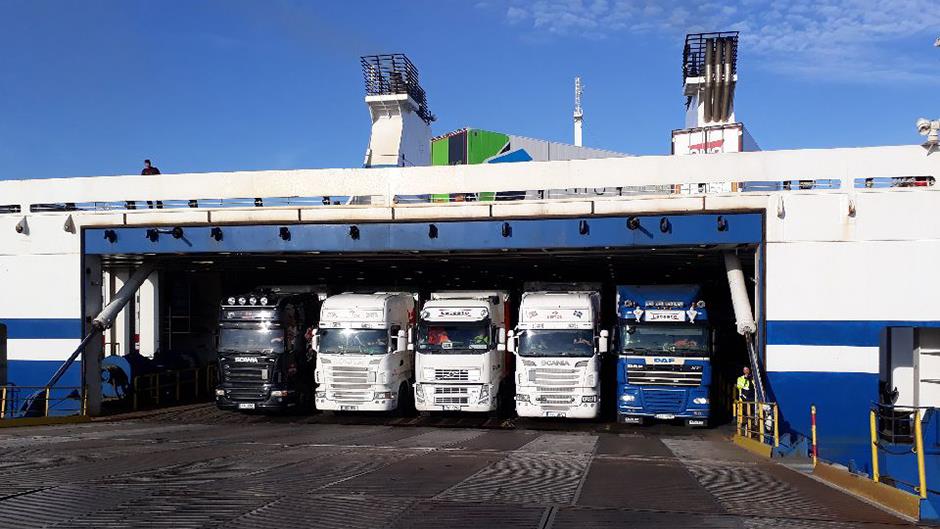 Trucks peeking out from a ferry