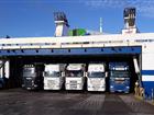 Trucks peeking out from a ferry