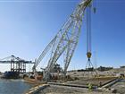A huge crane lifts a ramp